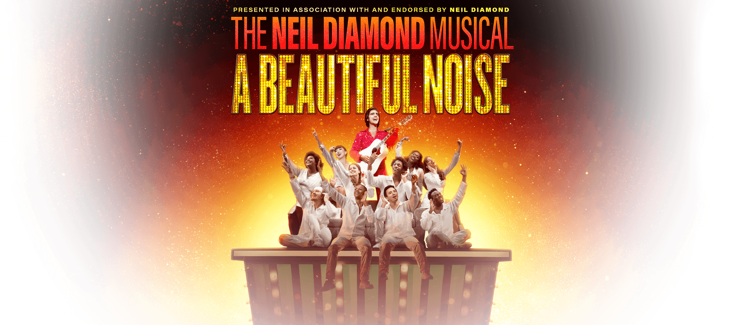 Show Art with words on it: Presented in Association with and endorsed by Neil Diamond: The Neil Diamond Musical A Beautiful Noise. Graphic art shows Neil Diamond playing his guitar with surrounding cast members singing along with him.